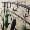 Black Metal Potting Bench with Wrought Iron Vine Details and Fabric Potting Sink